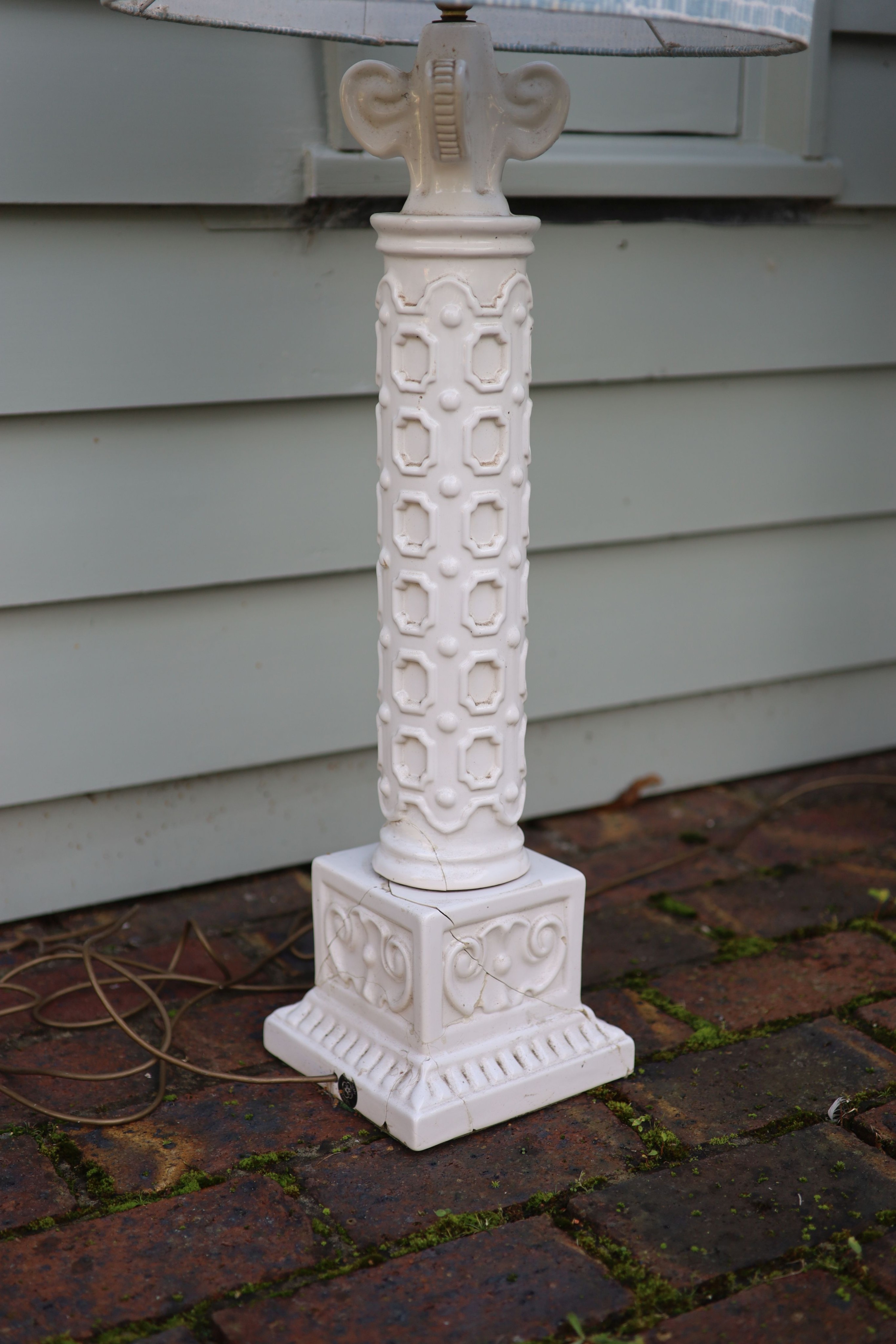 A pair of white glazed pottery table lamps, height to fittings 67cm (one a.f.)